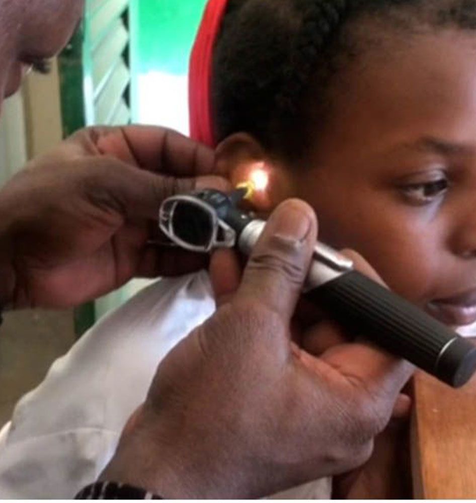 Awati, 11, has her new earmoulds fitted by Juste Clément.
